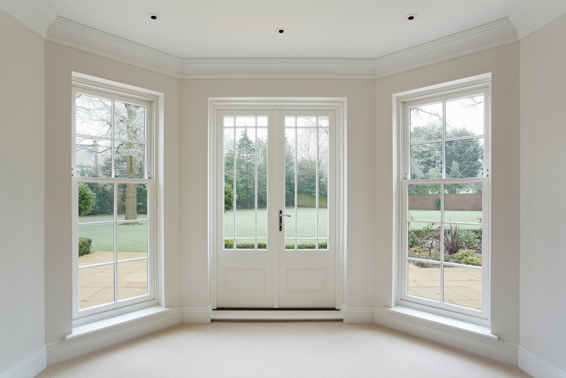 white bay windows and French doors